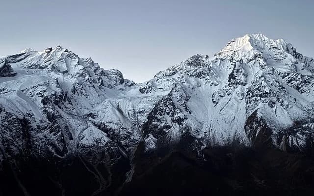 Green Langtang Valley beneath snow peaks