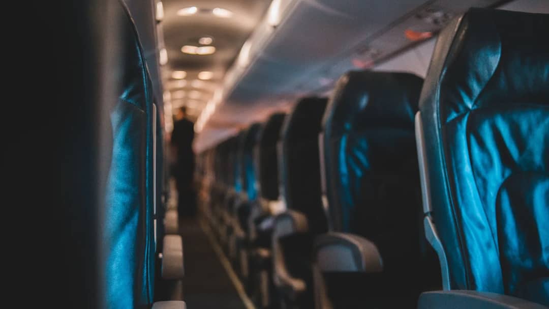 Rows of seats in an airplane cabin