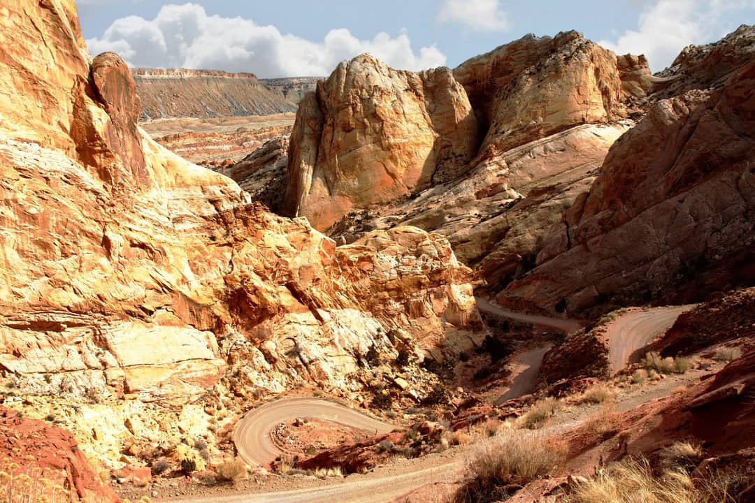 Switchbacks winding up through rugged desert rock formations in Utah