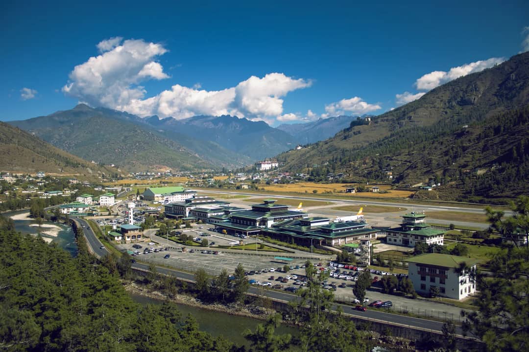 Scenic aerial view of Paro Airport nestled in the Bhutan mountains.