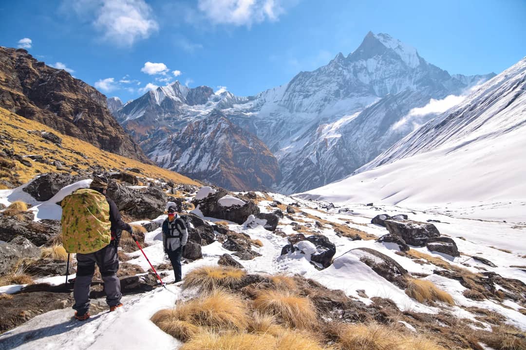 Trekkers walking a trail in the Nepal Himalaya