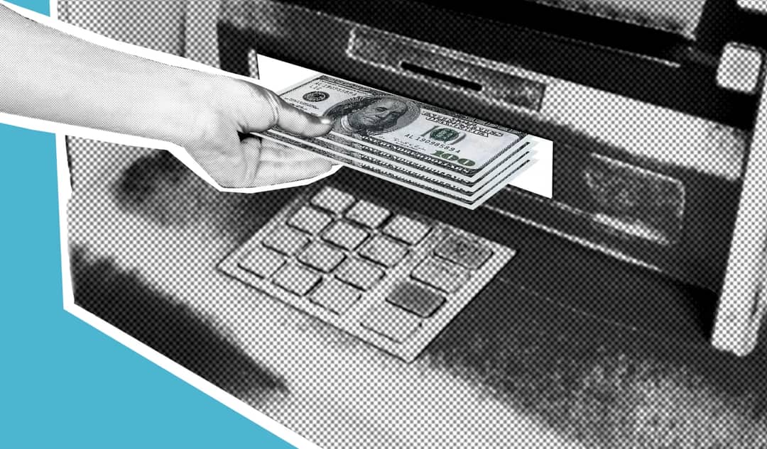 Decorative cardboard illustration of hand of person withdrawing pile of dollar banknotes from automated teller machine