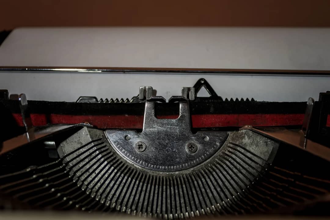 Close-up view of vintage typewriter parts highlighting the classic mechanical design.