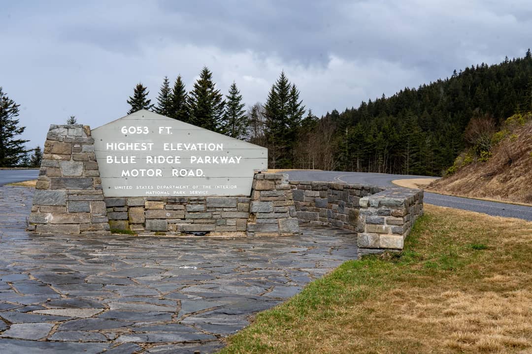 A stone elevation marker beside the Blue Ridge Parkway