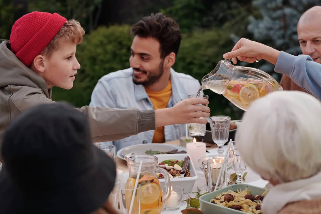 A family gathered around a table for a meal