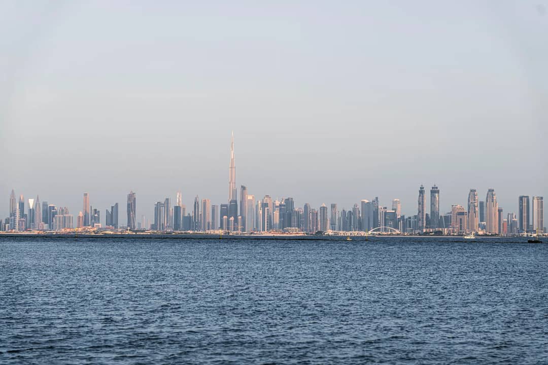 A stunning view of Dubai's skyline featuring Burj Khalifa across the sea.