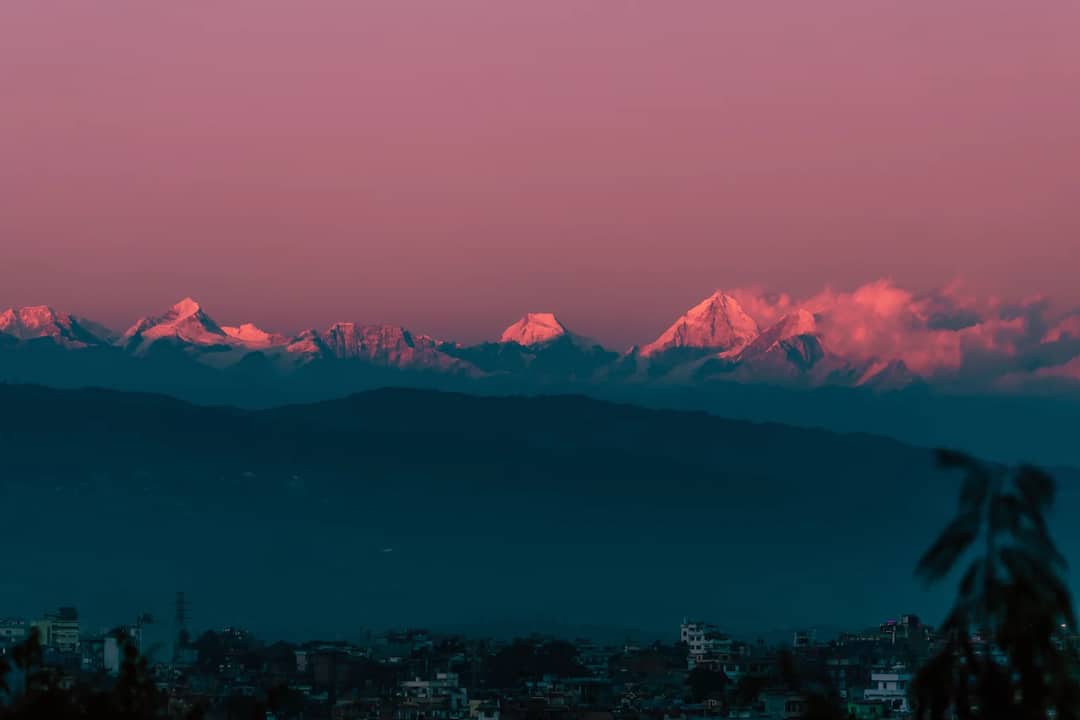 Breathtaking sunrise view of snow-capped Himalayan peaks seen over Kathmandu, Nepal.