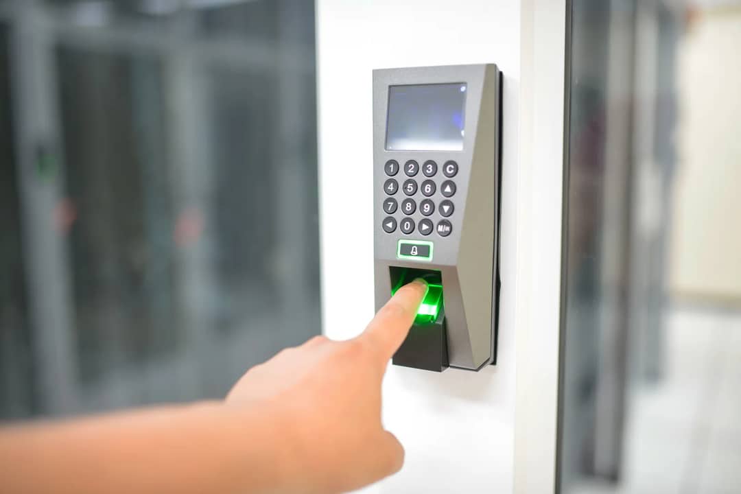 A finger being placed on a fingerprint scanner