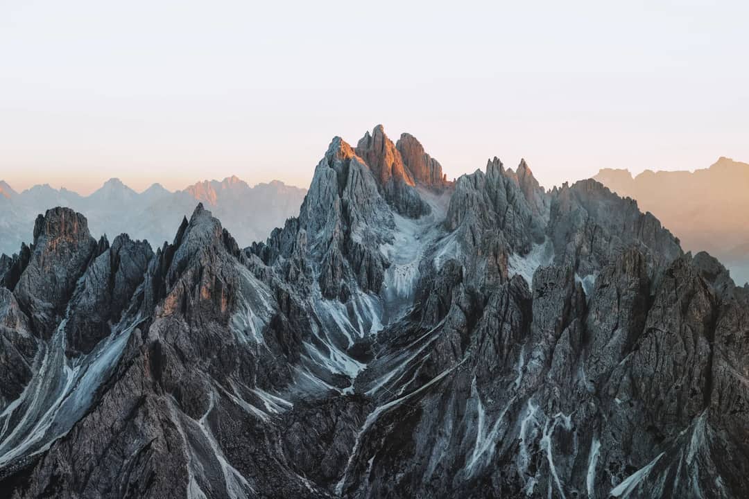 Jagged mountain peaks bathed in sunset light
