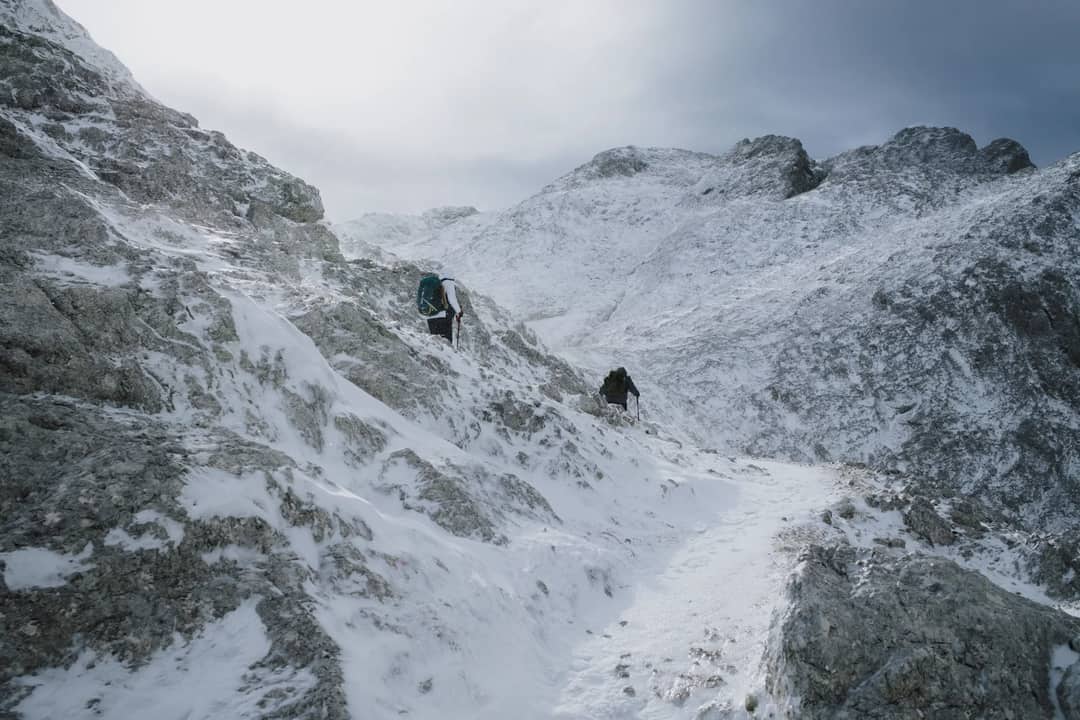 Hikers navigate a snowy trail in San Martino di Castrozza, Trentino-South Tyrol, Italy.
