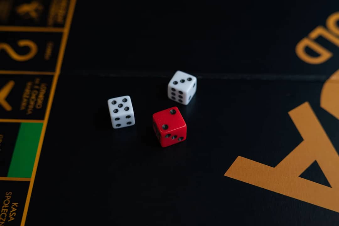 A close-up of red and white dice on a board game, evoking a sense of fun and strategy.