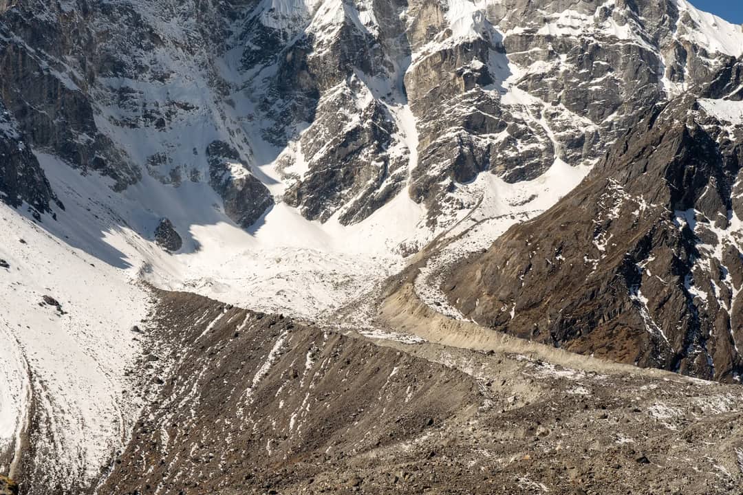 Stunning view of snow-capped mountain peaks and rocky terrain, a perfect winter landscape.