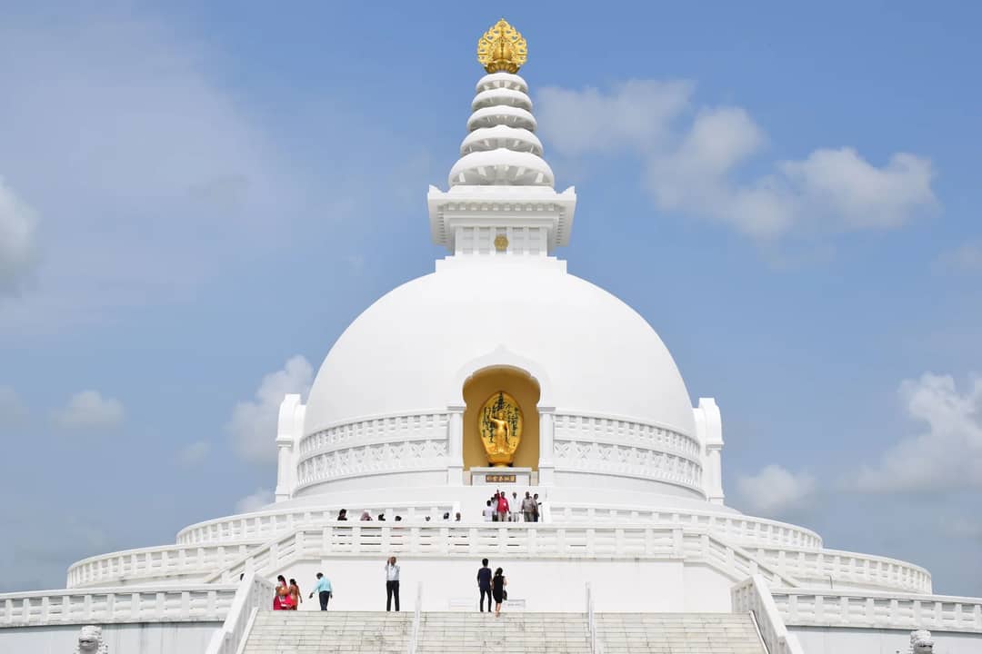 Breathtaking capture of Lumbini's iconic World Peace Pagoda against a clear sky.