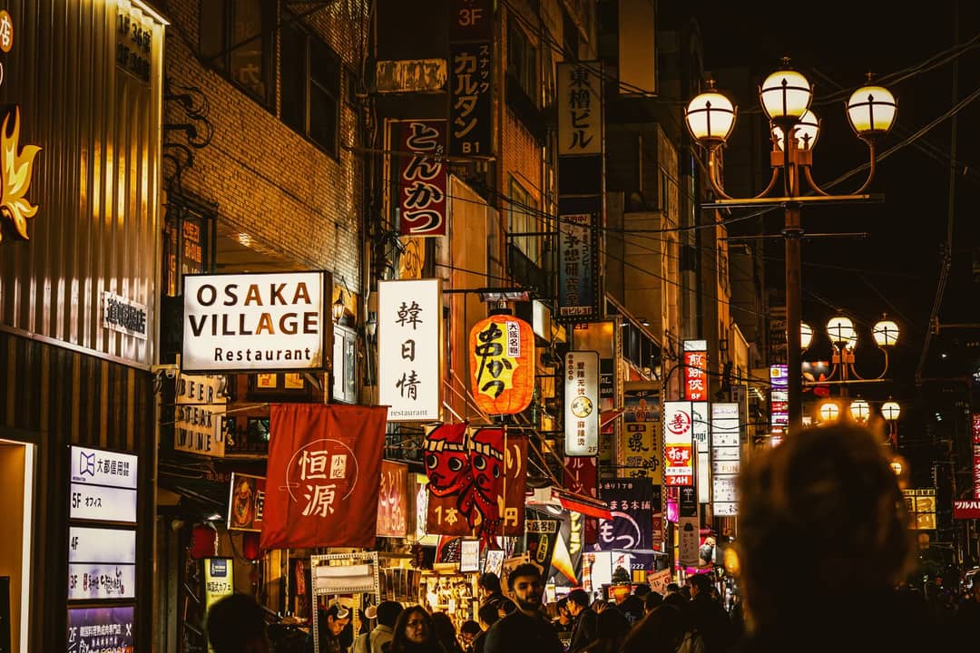 A crowded shopping street in Japan at night