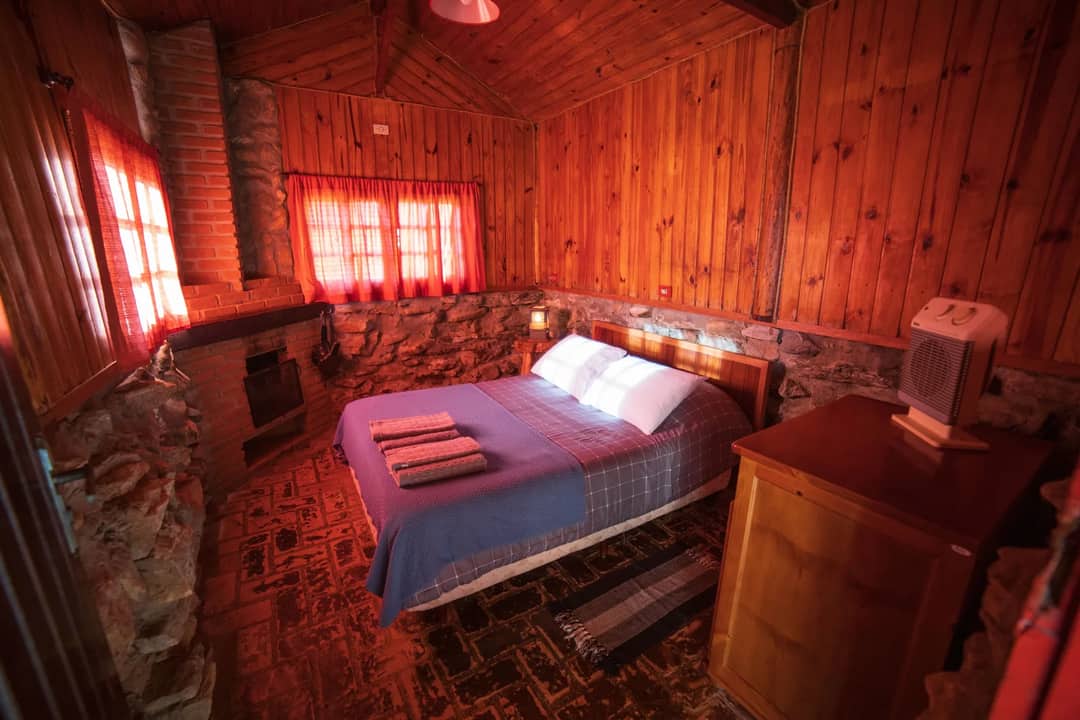 A simple bedroom with morning light through the window