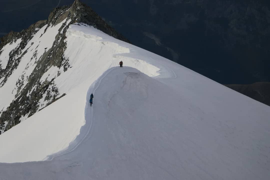 Climbers on a summit ridge