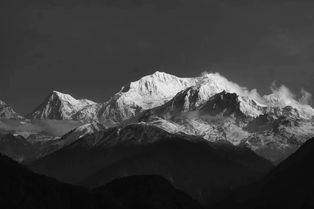 Breathtaking view of the snow-capped Himalayas from Pelling, India in monochrome.