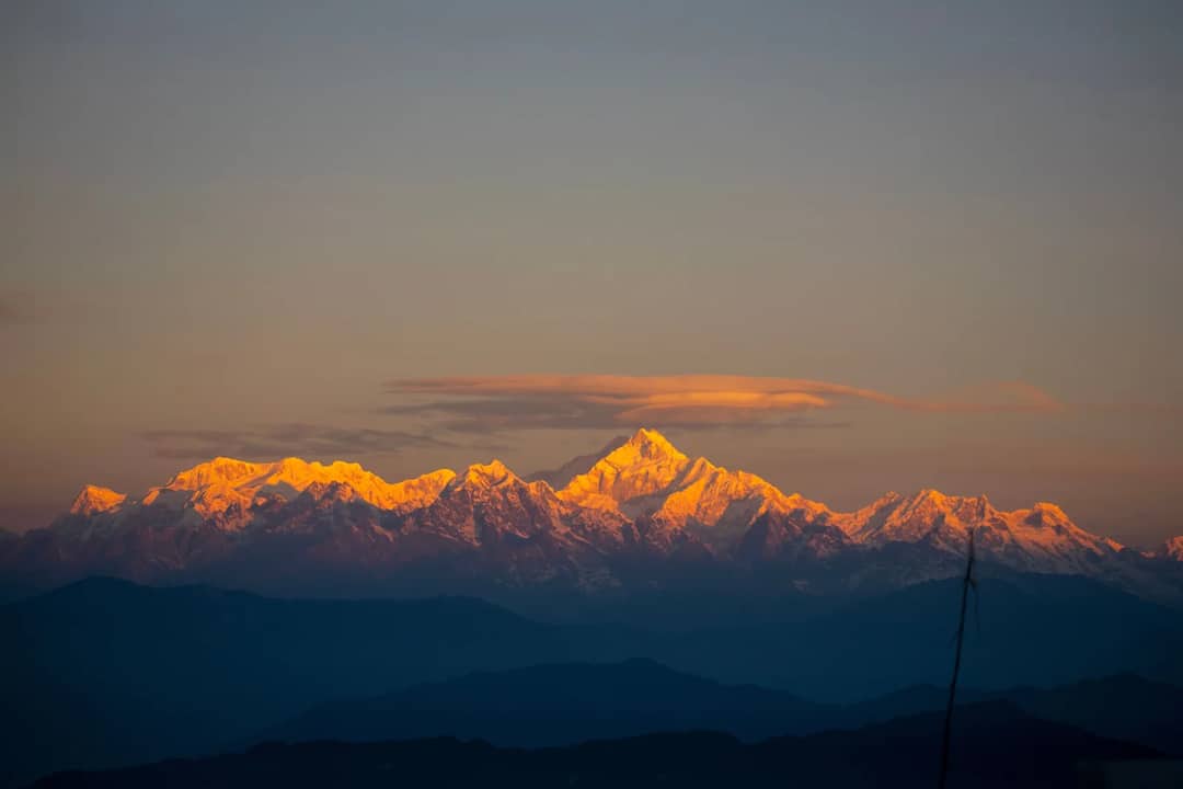 Stunning view of Kanchenjunga mountains at sunrise, captured from Rishop, India.
