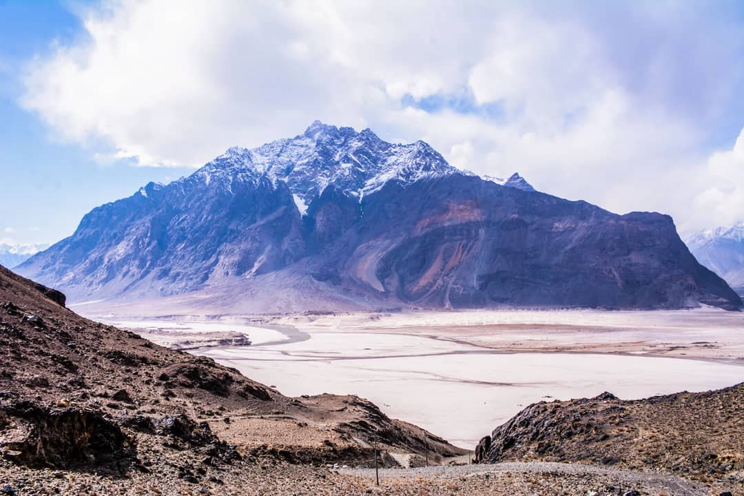 A high Karakoram peak under snow — four of the fourteen 8,000-metre mountains stand in this range