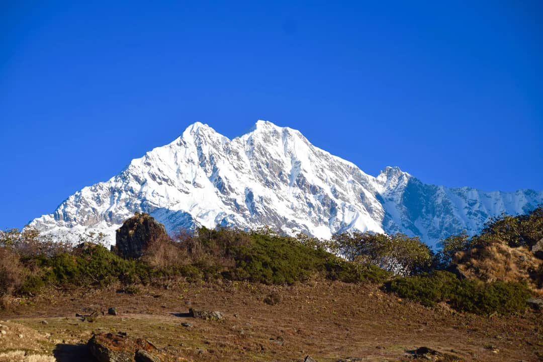 Scenic view of snow-capped Himalayan mountains under a clear blue sky.