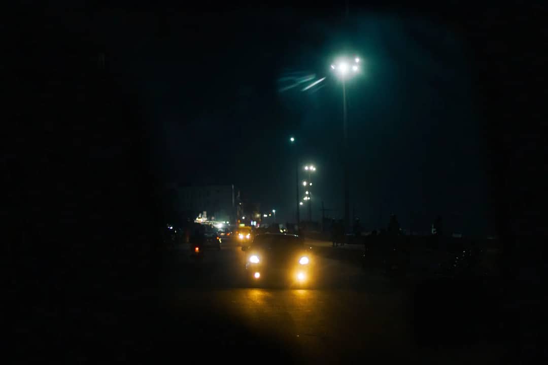 A vehicle on a winding road at night