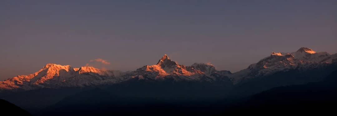 Snow-capped Annapurna peaks at sunset, seen from Narchyang, Nepal