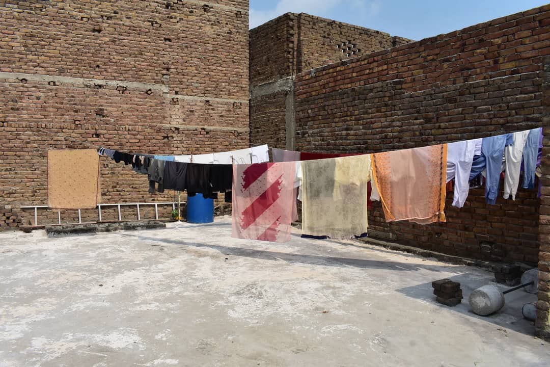 Washing hung out to dry in the open air — an overnight dry is the single thing synthetic does better than wool