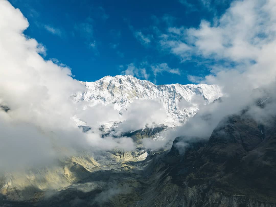 Snowcapped Annapurna range framed by cloud