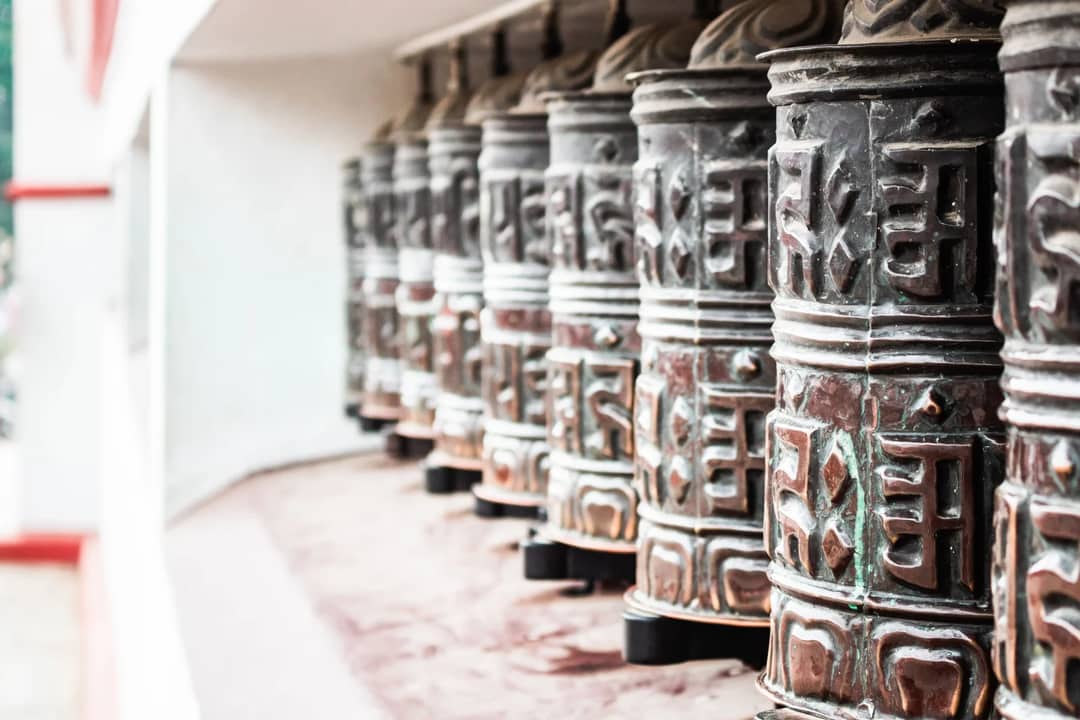 Close-up of traditional Buddhist prayer wheels in Kathmandu, Nepal.
