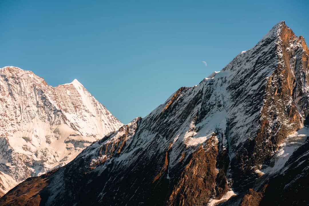 Snow-covered Himalayan peaks under a clear sky, Nepal