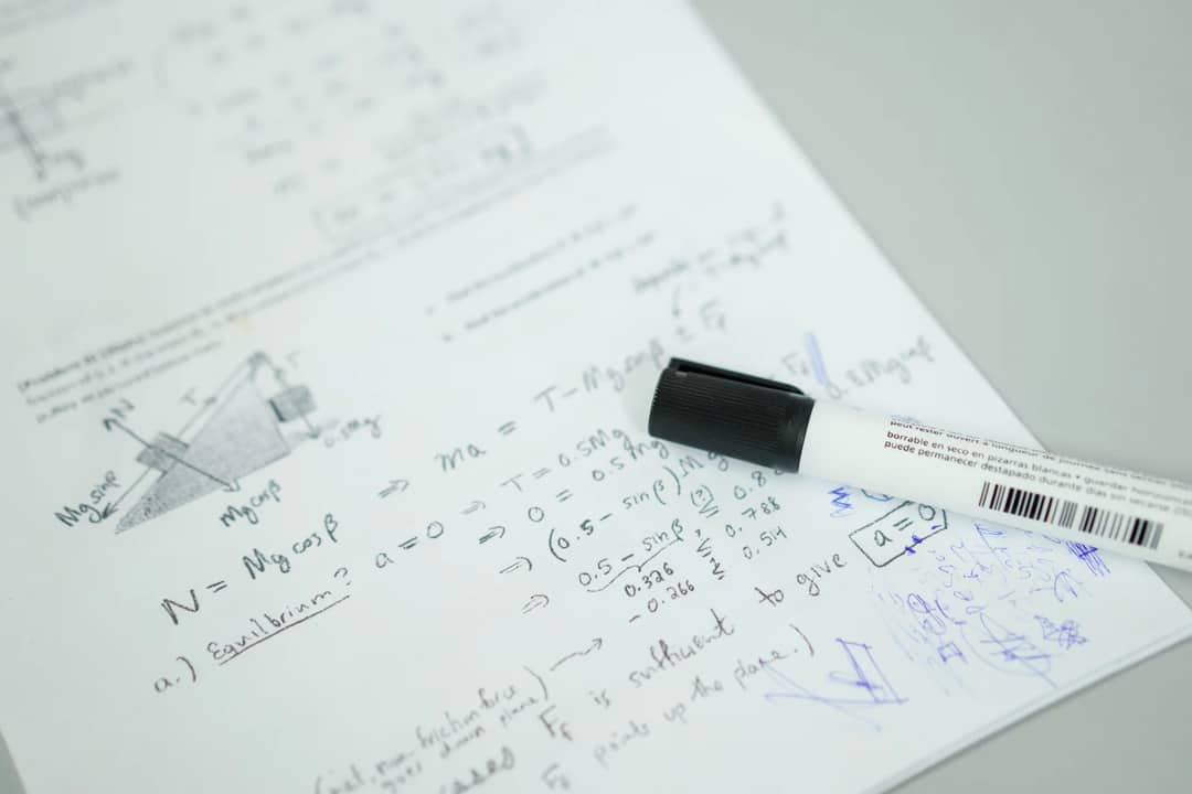 Mathematical formulas written on paper