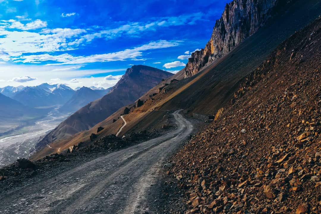 Majestic view of mountains and dirt road in Hikkim, Himachal Pradesh, India.