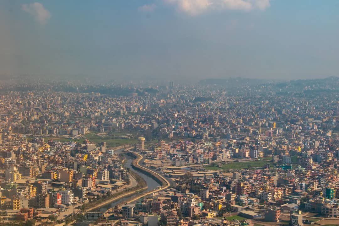 Vibrant cityscape of Kathmandu, Nepal showcasing urban sprawl under a clear sky.