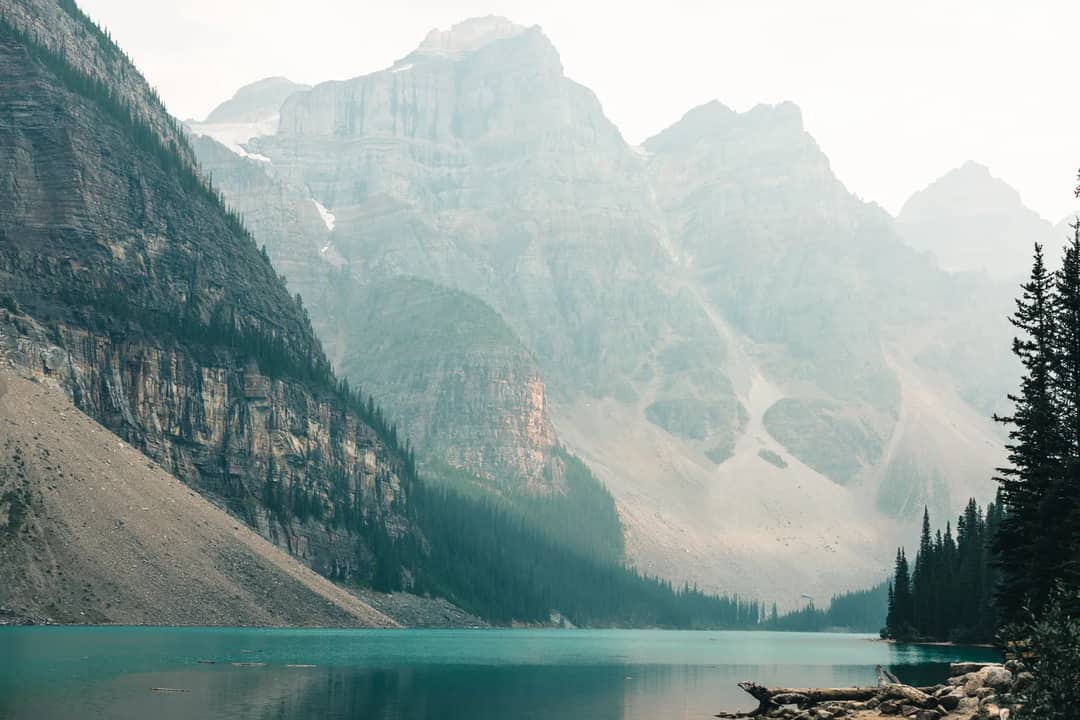 A glacier-fed lake below steep mountain walls