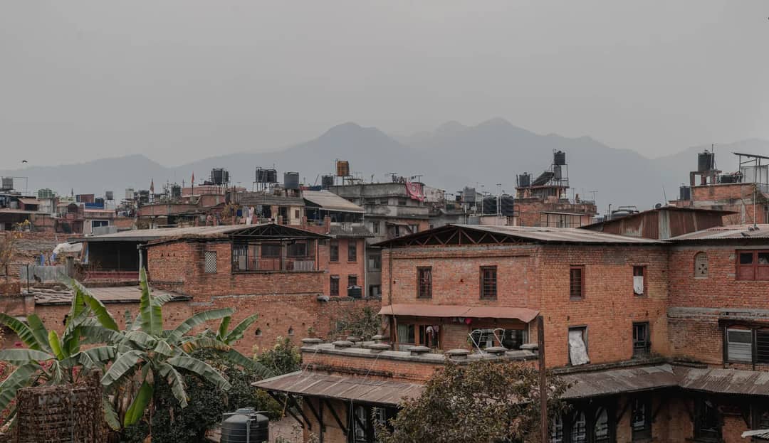 Kathmandu's brick buildings with a Himalayan backdrop