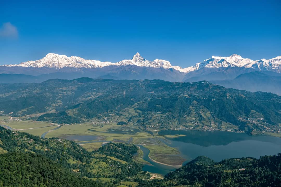 Snow peaks under a clear blue sky in Nepal