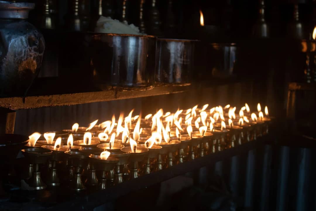 Butter lamps burning in a temple