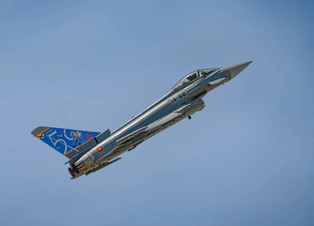 Eurofighter Typhoon jet flying against a clear blue sky, showcasing its sleek design.