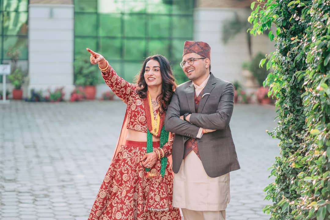 Smiling couple in traditional Nepalese attire during a wedding in Kathmandu.