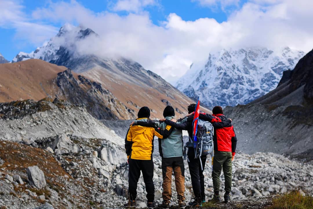 A guide talking with trekkers on a trail