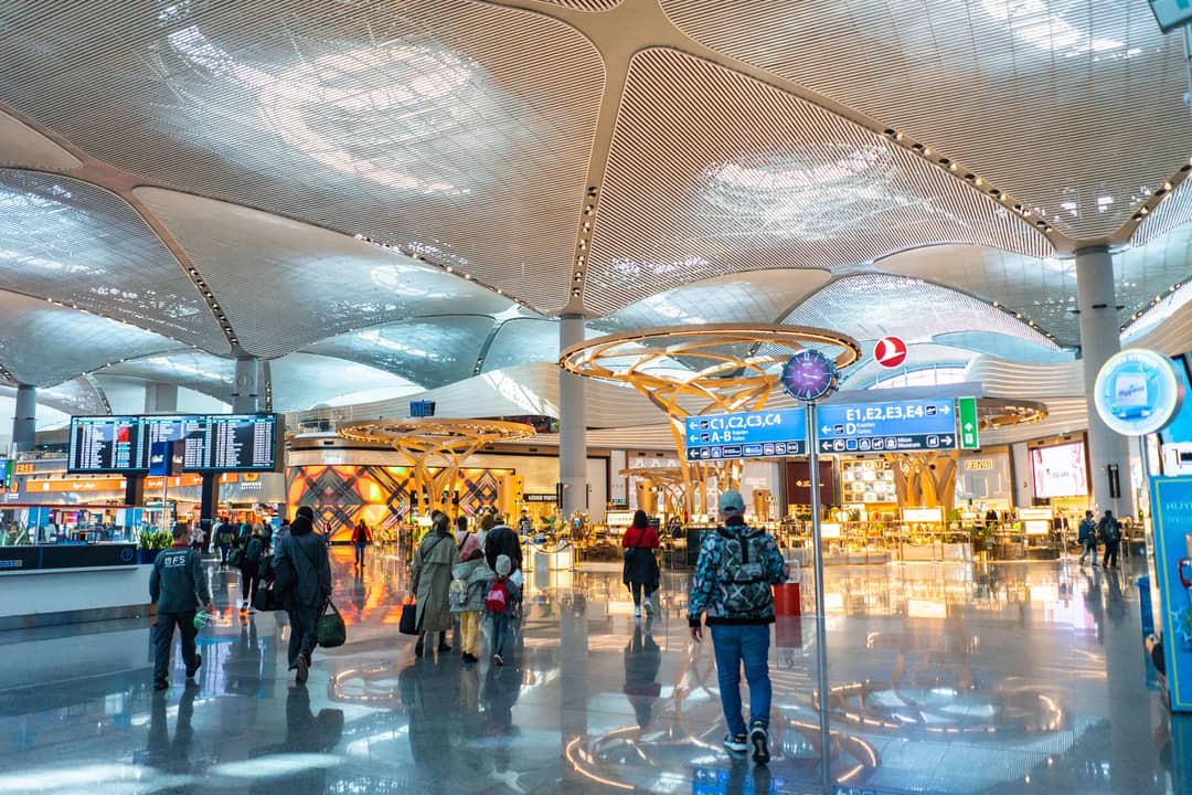 A crowd moving through a terminal