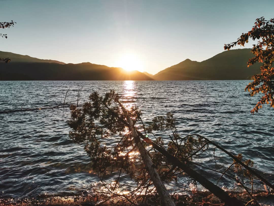 Captivating sunset over Rara Lake in Nepal, reflecting serene natural beauty.