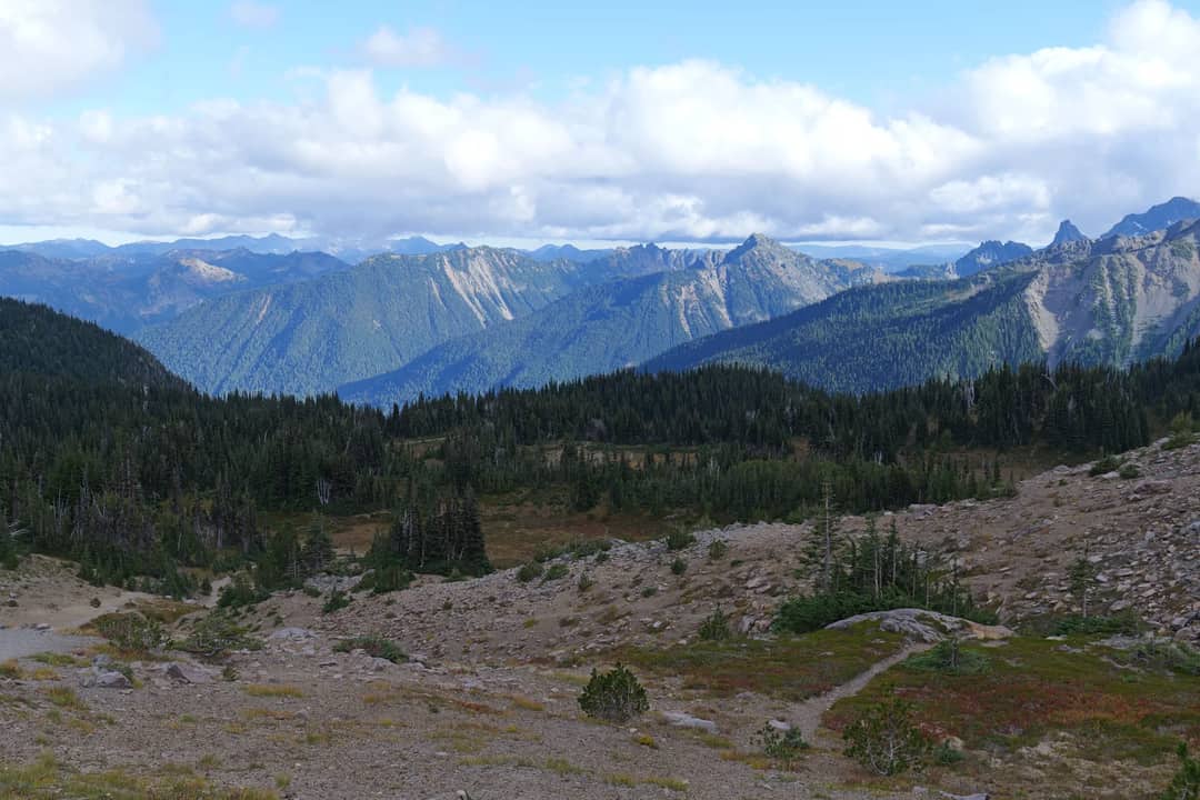Breathtaking view of mountains and forests in the Cascade Range under a vibrant sky.