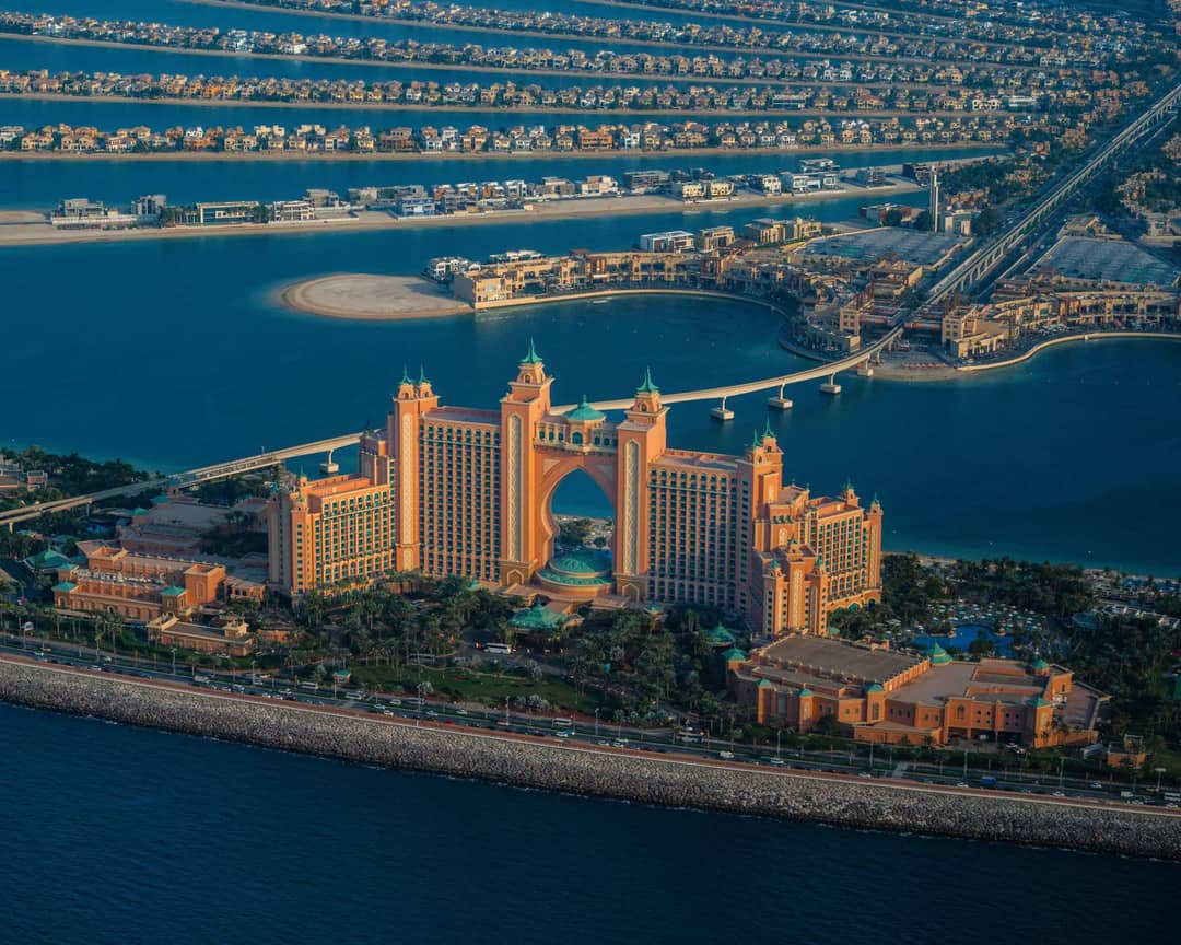 A breathtaking aerial view of Atlantis The Palm resort with surrounding water and palm-shaped islands in Dubai.