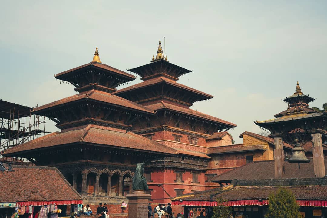 Historic multi-tiered temple in Patan Durbar Square, Nepal, showcasing traditional Nepalese architecture.