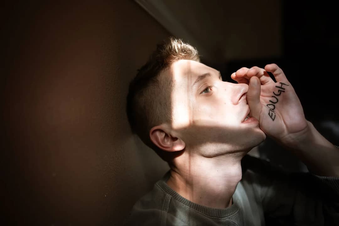 A powerful portrait of a young man expressing empowerment and self-awareness.