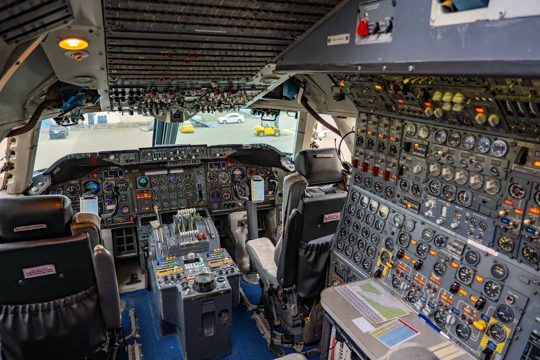 Detailed view of a vintage aircraft cockpit with numerous controls in Tbilisi, Georgia.