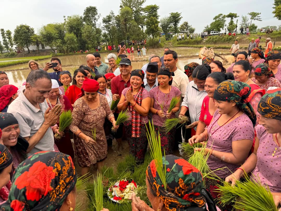 A joyful gathering of people engaged in a lively cultural ritual in Nepal.