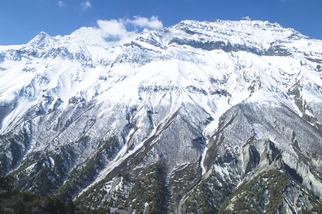 Breathtaking snow-covered mountain landscape in Manang, Nepal's Gandaki Province.