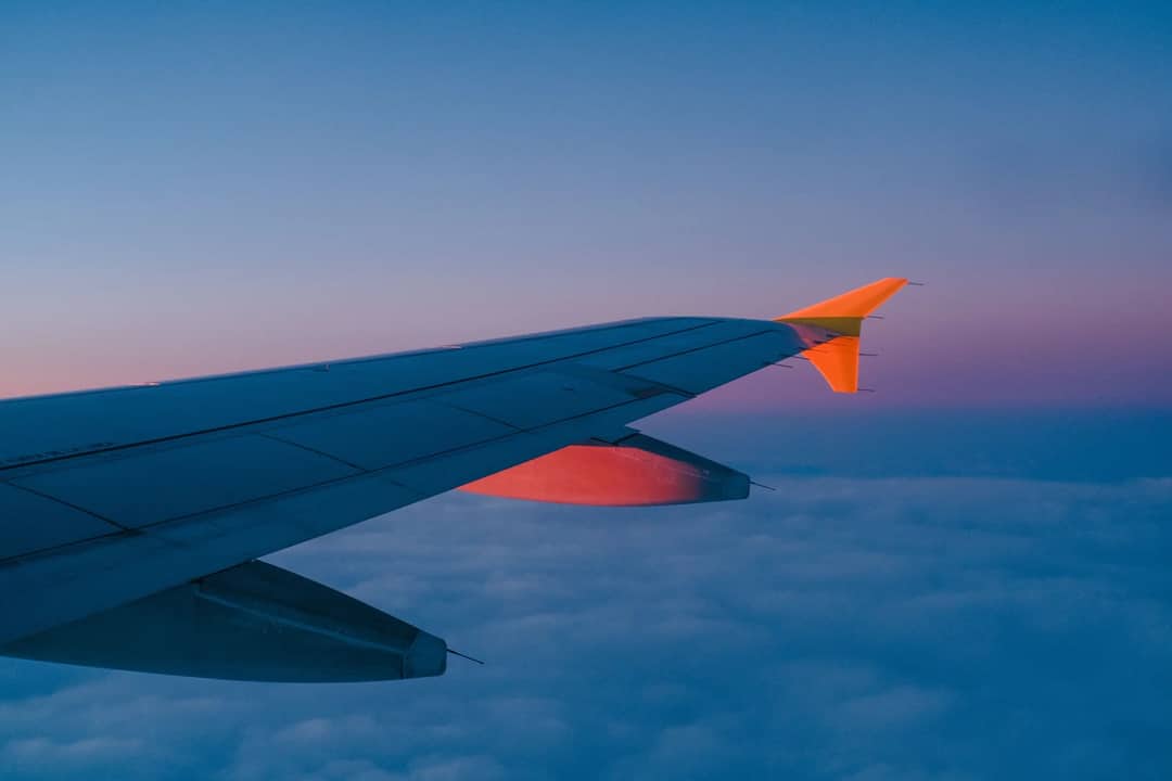 The view from an airliner window above the cloud deck, at the cruising altitude where jets pass the Himalaya